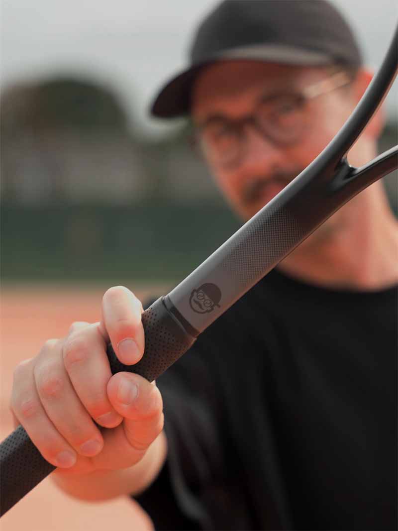 Coachholding a Saber with a blurred background