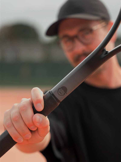 Coachholding a Saber with a blurred background