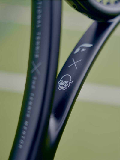 Close-up of  the Saber with tennis mentor collab branding on a blurred background